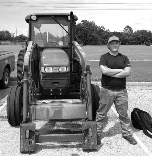 La Grange High School student Luke Chovanec kept alive the long standing LGISD tradition of drive-your-tractor-to-school day last week. Photo by Deacon Wick