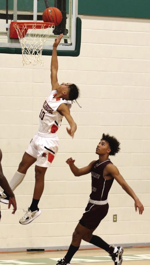 Schulenburg’s Byron Johnson drives for a lay-up in Monday’s playoff game. Photos by Audrey Kristynik