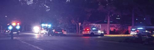 The scene of Wednesday night’s fatal shooting at the 400 block of Washington St. with multiple law enforcement and EMS personnel.