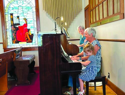 Betty Gail Guthmann, Sharon Fritsch and Sophia playing music st St. Paul Lutheran.