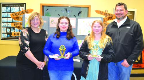 Poster Contest: (Division 2-Grades 3-6) - Brynlee Berger (St. Rose of Lima, Schulenburg), Tabitha Smith (Sacred Heart School); presenters: Chris Kaspar of Round Top State Bank and Jessica Montez of Fayette Electric Cooperative.