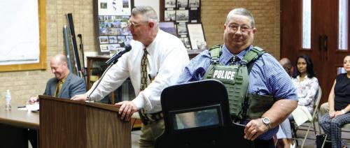 La Grange Police Chief David Gilbreath (left) and officer David Mohr (right) showed off their department’s new balistic shields and vests at the City Council meeting Monday night, March 27. Photo by Andy Behlen