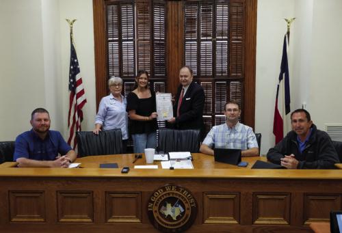 Fayette County Commissioners Court signed a proclamation last Thursday designating April as Fair Housing Month in Fayette County. On hand for the signing were representatives from the South Central Board of Realtors. Pictured are (from left) Pct. 4 Commissioner Drew Brossmann, Misty Blanchard of Centex Realty in La Grange, Hannah Mica of Legacy Land Associates in Flatonia, County Judge Dan Mueller, Pct. 2 Commissioner Clint Sternadel and Pct. 1 Commissioner Jason McBroom. Photo by Andy Behlen