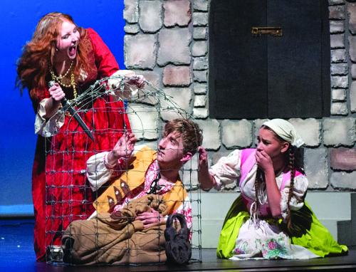 Molly Hudson, as the Witch, terrorizes Jackson Elliott (Hansel) and Brinley Freedman Gretel). Photo by Emma Anderson LHS yearbook staff
