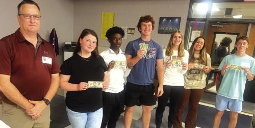 The La Grange LEO Club would like to thank Mr. Thomas Petras, left, Senior Vice President with Prosperity Bank for sponsoring their March LEO Club meetings. Mr. Petras spoke to the students about job opportunities within the banking industry, interview skills, loan and investment options, and conducted a fun game with cash rewards.