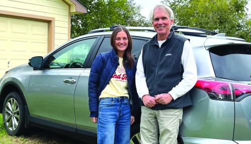 Erin Wotipka (Left) and Bill Bishop (Right) with the car Bishop donated to the group “And Then a New Day.”
