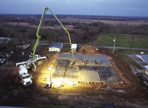 Workers with Supak’s Inc. poured a concrete slab for the new German-Czech Mart at the Fayette County Fairgrounds, working all day and late into the night on Thursday, Feb. 13.