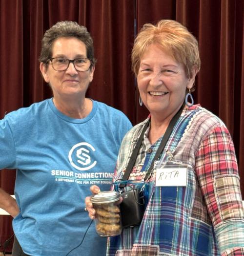 Stephanie Shroyer, Program Director with Senior Connections, is pictured here presenting Rita Hays with cookies from the cookie roundup for her bravery for sharing her story for Senior Spotlight in Weimar. Her story was very compelling about how painting and her love of horses brought her through some very difficult times.