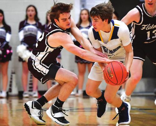 Justin Marler works for the steal for the Flatonia Bulldogs Thursday night in the Area playoff game against West Hardin. The Bulldogs earn the title with a 90-46 win. Photo by Stephanie Steinhauser