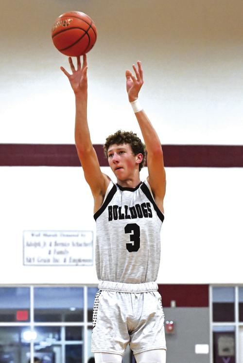 Camden Bosl puts up a three point shot for Flatonia in Tuesday night’s win over Iola to improve to 13-0. Photo by Stephanie Steinhauser