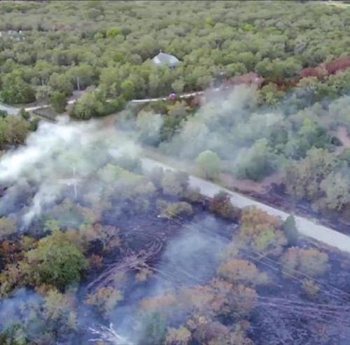 An aerial image shows the size of the fire on Three Mile Rd. Sunday.