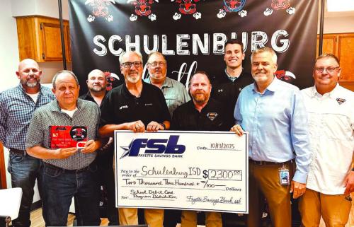 On hand as Fayette Savings Bank presented a check to Schulenburg ISD through its School Spirit Debit Card Program were (from left): Brad Tumis, Rodney Kalich – FSB, Jarrod Schramek – SISD board; Mike Olle, FSB; Michael Zweschper, Michael Demel, Hale Hentges, Supt. Lee Hafley, Troy Brenek – SISD board.