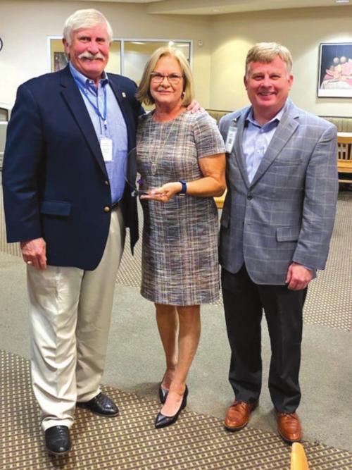 SMMC Board Chairman Dudley Piland, retiring Board member Lori Berger, and SMMC President and CEO, Mark Kimball, take a moment to celebrate Lori’s contributions to the Board.