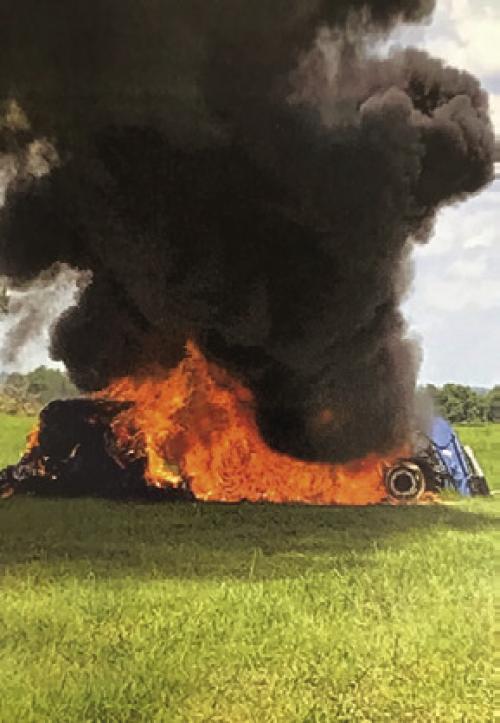 Tractor Catches Fire in Hay Field