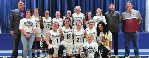 The Fayetteville girls basketball team celebrates its win Tuesday in Natalia ISD over Nueces Canyon.