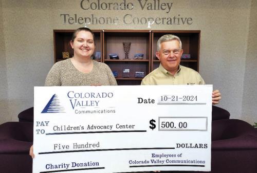 Colorado Valley Telephone Cooperative members donated funds to the Children’s Advocacy Center. Pictured from left to right are: Children’s Advocacy Center CEO Megan Webb and Colorado Valley Communications General Manager Kelly Allison.