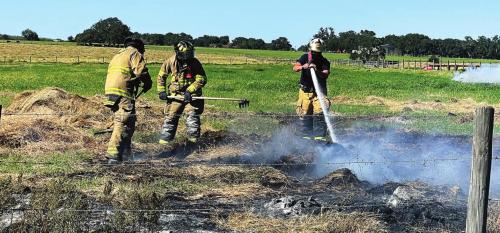 Firefighters battled strong winds last week in a fire near Fayetteville that took three days to put out. Photo by Andy Behlen
