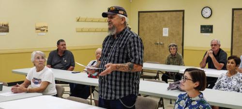 Jerry Moerbe of Nelsonville, pictured above, was part of a group of about 14 area citizens concerned about possible groundwater pollution from the Fayette Power Project who attended the Fayette County Groundwater Conservation District board meeting on Monday. Moerbe said he wants the District to step up groundwater monitoring. FCGCD General Manager David Van Dresar, pictured below, told the crowd that the District is prepared to launch a monitoring campaign. Photos by Andy Behlen