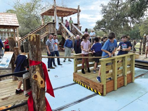 Children use the Kreische ferry to cross the “Colorado River” on the educational playscape.