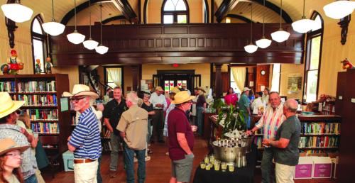 Guests enjoy champagne and cake to kick off the groundbreaking celebration inside RTFL’s Main Library building.
