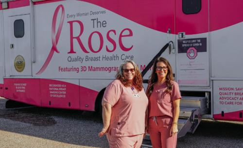 Tejas Health Care Director of Nursing Kellie Jakobeit (left) and patient coordinator Brandy Wessels (right) stand outside The Rose mobile mammography bus, which visited La Grange on Tuesday to offer breast cancer screenings to uninsured patients. Tejas Health Care will team up with The Rose to offer another screening event at their Giddings clinic on Dec. 9. Photo by Andy Behlen