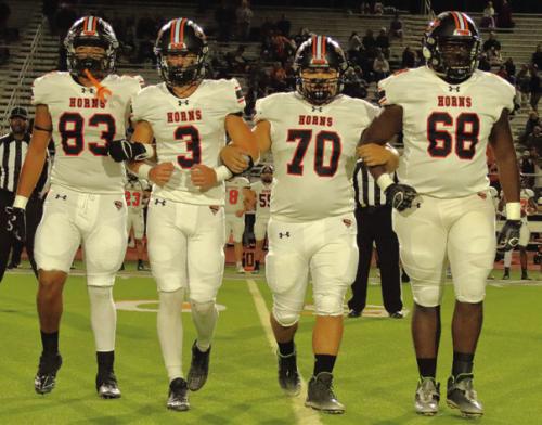 The Schulenburg captains walk to the coin toss before Friday’s game, left to right: Jayvan Luhrs, Aaron Janecek, Marshall Wellborn and Rogerick Walton. Photo by Darrell D. Gest