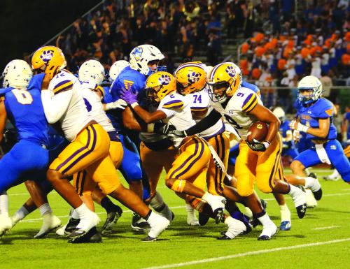La Grange’s Jakobe Wilkerson looks for running room as Makiah Alexander (72), Jaden Williams (2) and Favian Gutierrez (74) block for him Friday in Lago Vista. Photo by Darrell D. Gest