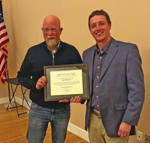 Master of Ceremonies Mac Brooks, right, presenting the Most Valuable Citizen award to Jack Thompson, left, the La Grange City Manager.