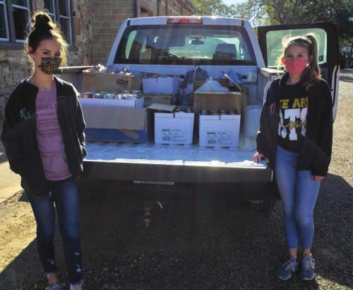 The Round Top-Carmine Jr. Beta Club collected 862 lbs. of food for the AMEN food pantry located in La Grange. Pictured with the boxes of food are Bayley Pitts, Vice President of the club (left), and Tess Eilers, President (right). Students at the RT-C High School and Jr. High campus in Carmine participated in the event.