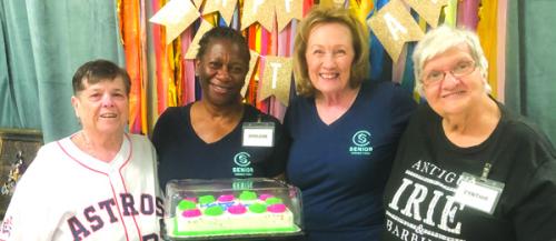 August birthdays were celebrated with Julie Hill, Darlene Williams, and Sharon Rodriguez pictured with a cake donated by Sandy Anderson and True Care Living in Columbus.