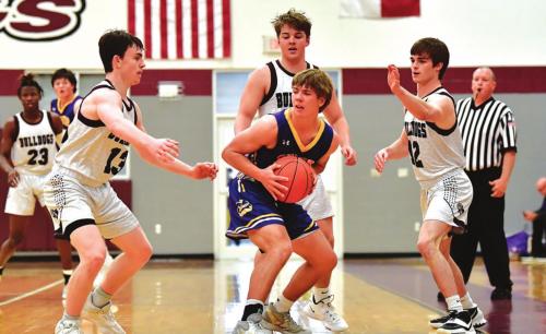 Flatonia’s Luke Law, Justin Marler and Dayton Cliffe pressure Shiner’s Drew Wenske in Friday’s win to keep the Bulldogs undefeated in district. Photo by Stephanie Steinhauser