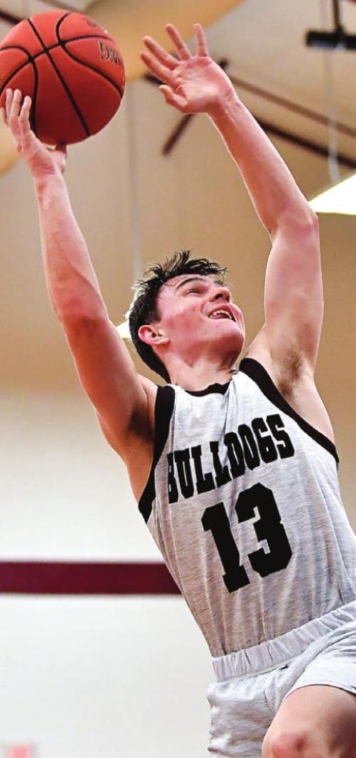 Flatonia’s Luke Law goes up for two for the Flatonia Bulldogs in Tuesday’s game against Snook. Photo by Stephanie Steinhauser
