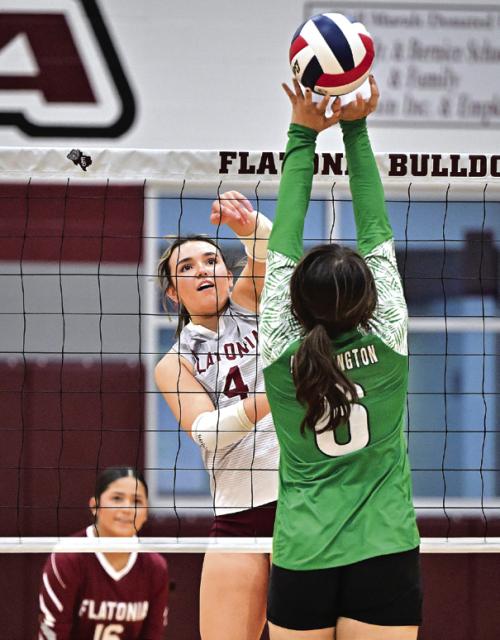 Flatonia Senior Kat Sullivan gets a hit past Bloomington. Flatonia defeated Bloomington in three sets on Friday. Photo by Stephanie Steinhauser