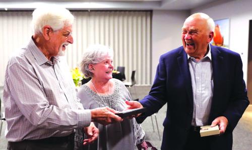 Harold “Hal” Stall, Dorothy Stall, and Harvey Hartman an original foundation member with a VHS video tape that Stall used to pitch fundraising for Space Center Houston. Photos by David Stall