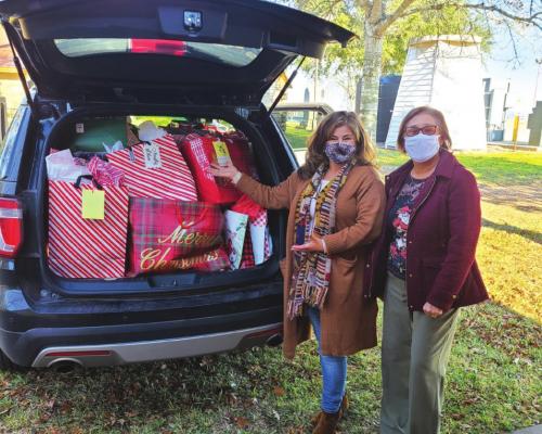 Noelia Buck, left, Senior Nutrition Program Director and Mary Lou Anderle, right, Histyn Parish Office Assistant pose with some of the Angel Tree donations.