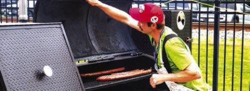 Some extra-long links heat up on the grill at Sausagefest.