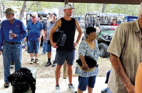 The lines for BBQ at Holy Cross church picnic are a reflection of how popular their BBQ is in the Warda community.