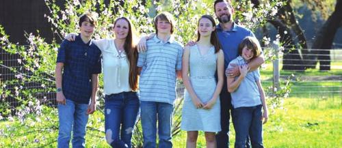 Kim Landis, her husband Marc, and their four kids.