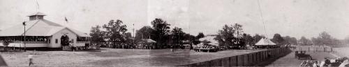 Ladies with Spinning Wheels at Fairgrounds – 1929: Photograph of four elderly women with spinning wheels in front of the exhibit hall at the fairgrounds during the September 1929 Fayette County Fair. The woman seated at right appears to be Olivia (Tuttle) Willrich. 