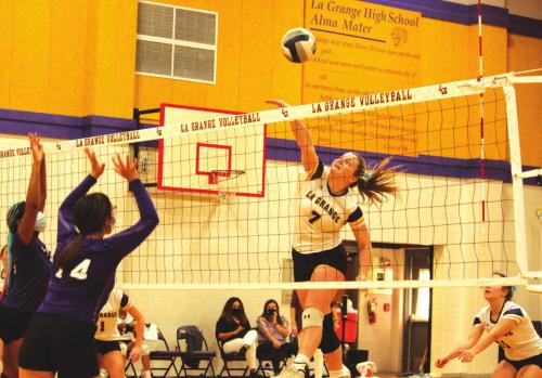 La Grange’s Natalie Blackwell spikes the ball in action Tuesday against Austin Achieve. Photos by Jeff Wick
