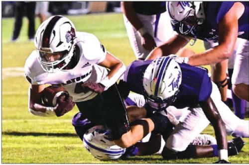Flatonia’s Beck Zimmerman picks up the first down for the Bulldogs. Photo by Stephanie Steinhauser