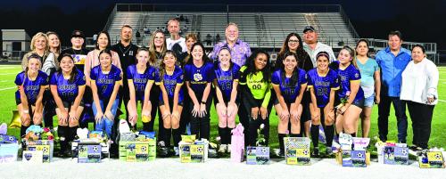 The seniors members of the La Grange soccer team were honored on the field with their parents prior to Tuesday’s home finale. Front row, left to right – Ellee Sodolak, Dulce Merlos, Evelyn Hernandez, Hailey Hill, Joana Lara, Head coach Lauren Hubbert, Elizabeth Hart, Hailee Burns, Gisela Portales, Karla De La Cruz and Hailee Martinez. Photo by Stephanie Steinhauser