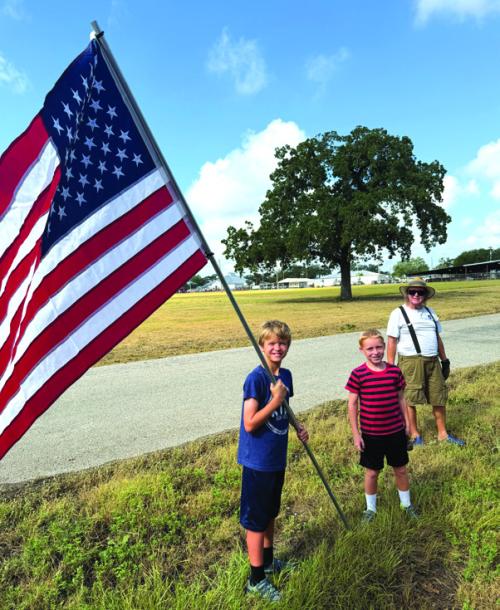 The tradition continues as Erich Lehmann and his sons Johann and Caleb, and Erich’s dad Mark helped put up the patriotic flags for the fair, lining Veterans Memorial Drive last week.